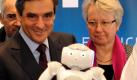 Frankreichs Premierminister Francois Fillon und Bundesbildungsministerin Annette Schavan (CDU) lassen sich in Hannover bei einem Rundgang über die Hannover Messe den Roboter Nao vorfürhen, der einer französischen Firma gehört. Mehr als 6500 Aussteller aus 65 Ländern werden zur Industriemesse in Hannover erwartet. Das Partnerland der Hannover Messe ist in diesem Jahr Frankreich. Foto: dapd