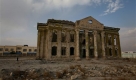 This Nov. 5,  2009 photo shows a building shelled to ruins by warlords during the civil war of the early 1990's. Now these feared ex-warlords are back in positions of power, in part because the U.S. turned to them in 2001 to help oust the Taliban after the Sept. 11 attacks.  (AP Photo/Musadeq Sadeq) Foto: ap
