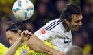 Nordrhein-Westfalen/ Wolfsburg's Sotirios Kyrgiakos, right, pushes his elbow into Dortmund's Neven Subotic of Serbia, center, beside Dortmund's Robert Lewandowski of Poland, left, during the German first division Bundesliga soccer match between Borussia Dortmund an VfL Wolfsburg in Dortmund, Germany, Saturday, Nov. 5, 2011. Innenverteidiger Neven Subotic vom Deutschen Meister Borussia Dortmund hat sich im Bundesligaspiel gegen den VfL Wolfsburg (5:1) einen Mittelgesichtsbruch zugezogen und wird sechs Wochen ausfallen. 'Er muss operiert werden und faellt sechs Wochen aus', sagte Dortmunds Trainer Juergen Klopp. Kurz vor der Halbzeitpause war der 22-Jaehrige offenbar bei einem Luftduell mit Wolfsburgs Sotirios Kyrgiakos zusammengestossen und von dessen Ellbogen hart im Gesicht getroffen worden. Subotic wurde minutenlang behandelt und blieb zur Halbzeit in der Kabine. (zu dapd-Text) Foto: Martin Meissner/AP/dapd Foto: dapd