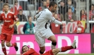 Der Münchner Danijel Pranjic grätscht erfolglos gegen Frankfurts Selim Teber. Die Frankfurter Eintracht hielt lange dagegen und führte sogar. Foto: dpa