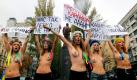 Bekleidet mit etwas mehr als nichts demonstrieren ukrainische Feministinnen gegen den Besuch des russischen Premierministers Wladimir Putin in Kiew. Die feministische Gruppe Femen protestiert damit unter anderem gegen den immer größer werdenden Einfluss Russlands. Foto: dapd