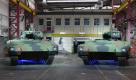 Puma-Schützenpanzer in der Produktionshalle des Rüstungsunternehmens Krauss-Maffei Wegmann: Die Münchner Firma stellt auch den Leopard-Panzer her. Hinter dem Düsseldorfer Unternehmen Rheinmetall ist Krauss-Maffei Wegmann der zweitgrößte deutsche Rüstungskonzern. Laut Spiegel Online arbeiten in Deutschland rund 80.000 Menschen in der Rüstungsindustrie. Foto: dapd
