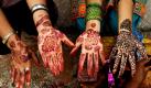 Nepalesische Hindu-Frauen zeigen im Pashupati-Tempel in Kathmandu ihre mit Henna bemalten Hände. Foto: dpa