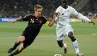 Germany's Philipp Lahm (L) and Ghana's Jonathan Mensah vie for the ball during the 2010 FIFA World Cup group D match between Ghana and Germany at Soccer City, Johannesburg, South Africa 23 June 2010. Photo: Marcus Brandt dpa - Please refer to http://dpaq.de/FIFA-WM2010-TC +++(c) dpa - Bildfunk+++ Foto: dpa