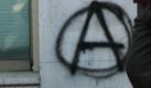 People walk by a graffiti reading 'eat the rich', sprayed on the wall of a bank office in central Athens, Greece on 21 December 2009. Greece's national debt has reached a record of 300 million euros, further raising fears that the country is about to go into economic meltdown. EPA/ORESTIS PANAGIOTOU +++(c) dpa - Bildfunk+++ Foto: dpa