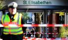 Ein Polizist steht in Lörrach vor dem St. Elisabethen-Krankenhaus. Nach dem gestrigen Amoklauf in dem baden-württembergischen Ort, bei dem vier Menschen getötet wurden, rätselt die Polizei weiter über das Motiv der Täterin. Nach dem bisherigen Ermittlungen gehen Polizei und Staatsanwaltschaft von einer Beziehungstat aus. Foto: dapd