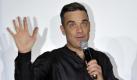 Auch Robbie Williams hat ab und zu einen Hänger. Schlecht ist es nur, wenn es bei einem eigenen Song passiert. Robbie ent«feel» der Text eines seiner größten Erfolge. Macht nix, Rockstars dürfen das. Foto: dpa