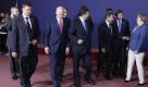 From left, Belgium's Prime Minister Yves Leterme, Latvian Prime Minister Valdis Dombrovskis, Greek Prime Minister George Papandreou, Spain's Prime Minister Jose Luis Rodriguez Zapatero, European Commission President Jose Manuel Barroso, French President Nicolas Sarkozy, Portugal's Prime Minister Pedro Passos Coelho and German Chancellor Angela Merkel walk together after a group photo at an EU summit in Brussels on Thursday, June 23, 2011. Greece's financial meltdown is set to overshadow yet another summit of European Union leaders, who on Thursday will discuss new ways to get the country back on its feet and protect the euro's stability. (AP Photo/Michel Spingler) Foto: dapd
