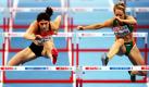 Im Pariser Palais Omnisports finden momentan die Leichtathletik Hallen-Europameisterschaften statt. Die Deutsche Carolin Nytra (l) läuft im Vorlauf über 60 Meter Hürden neben der Irin Derval O'Rourke über die Hürde. Foto: dpa