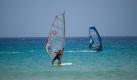 Ausschau halten nach knackigen Surferboys? Das geht am besten am Pula Beach auf Sardinien - ein Mekka für Wassersportler. Und das Beste: Nach zwei Stunden Flugzeit von einem deutschen Flughafen aus können Sie bereits den Strand und Surfer in Augenschein nehmen. Foto: flickr/1la/Creative Commons Licence