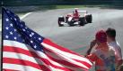 Michael Schumacher passiert 2001 in Monza die «Stars and Stripes», die Streckenposten zum Gedenken aufgestellt hatten. Foto: dpa