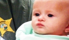Der Sheriff Bobby Haddock hält das Baby Shannon Dedrick in Florida auf dem Arm. Die Polizei hat fünf Tage nach dem vermissten Kind gesucht und es schließlich in einer Holzbox unter dem Bett des Babysitters gefunden. Foto: ap