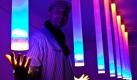 Der Chillout-Lichtdesigner Jörn Hanitzsch steht zwischen einem seiner leuchtenden Kunstwerke. Dieses und etwa 85 weitere Kunstwerke sind derzeit in einer Sonderausstellung über Lichtkunst im ehemaligen Gebäude der Brandenburgischen Kunstsammlungen Cottbus zu sehen. Foto: dpa