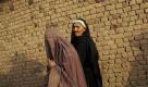 Afghanische Flüchtlinge laufen durch einen Vorort der pakistanischen Millionenstadt Islamabad. Foto: ap