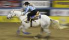 Tammy Fischer competes during the barrel racing event at the National Finals Rodeo in Las Vegas on Thursday, Dec. 3, 2009. (AP Photo/Laura Rauch) Foto: ap