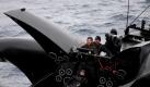 A handout photograph made available by the Institute of Cetacean Research of activists on anti-whaling protest vessel, the Ady Gil, carrying a projectile launcher, during a confrontation with Japanese whaling vessel the Nisshin Maru, Australia, 06 January 2010. An anti-whaling protest ship was taking on water after colliding with a security vessel of the Japanese whaling fleet in the Antarctic, the Sea Shepherd Conservation Society's leader said 06 January. Paul Watson said five of the six crew members aboard the high-speed trimaran were rescued and taken aboard an accompanying protest ship, the Bob Barker. The captain stayed with the 1.5-million-US-dollar Ady Gil, in the hope of saving it from sinking. EPA/INSTITUTE OF CETACEAN RESEARCH/HANDOUT AUSTYRALIA AND NEW ZEALAND OUT EDITORIAL USE ONLY/NO SALES +++(c) dpa - Bildfunk+++
 Foto: dpa