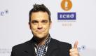 Robbie Williams und seine Frau Ayda unternehmen gerne nächtliche Ausflüge, um Ausschau nach Ufos zu halten. Der Sänger wollte angeblich sogar seine Musikkarriere aufgeben, um Ufologe zu werden - hat sich dann aber offensichtlich dagegen entschieden. Foto: dpa