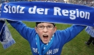 Ein junger Fan der TSG 1899 Hoffenheim posiert in der Rhein-Neckar-Arena. Foto: dpa
