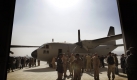 Afghan Air Force soldiers greet each other after inspecting a C-27 transport plane at Kabul airport, Afghanistan, Sunday, Nov. 15, 2009. Two new C-27 transport planes were donated by Italy and the United States to the Afghan Air Force. (AP Photo/Anja Niedringhaus) Foto: ap