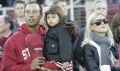FILE - This Nov. 21, 2009, file photo shows Tiger Woods, daughter Sam Woods,  and wife Elin Nordegren, before an NCAA college football game in Stanford, Calif. Golf's biggest star on Friday, Feb. 19, 2010, will address the shocking and sordid sex scandal that has consumed his life since late November then will return to the clinic where he has been undergoing therapy, according to a letter from PGA Tour commissioner Tim Finchem obtained by The Associated Press. (AP Photo/Marcio Jose Sanchez, File) Foto: ap