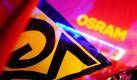 Gewerkschaftler demonstrieren vor dem Osram-Werk in Berlin. Im Tarifkonflikt der Schlüsselindustrie Metall und Elektro ist es zu ersten Warnstreiks gekommen. Foto: Hannibal  Foto: dpa