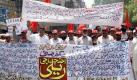Pakistanische Arbeiternehmer demonstrieren am Tag der Arbeit in Hyderabad. Foto: Nadeem Khawer.  Foto: dpa