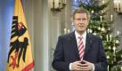Bundespräsident Christian Wulff bei der Aufzeichnung der Weihnachtsansprache 2011. Foto: Bundespresseamt/Jesco Denzel Foto: dpa