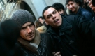 British soccer star David Beckham is mobbed by media and fans as he walks in downtown Milan, Italy, Sunday, Dec. 21, 2008. David Beckham's arrival at AC Milan was greeted with great fanfare and a modicum of skepticism over whether the 33-year-old midfielder will be able to contribute to his new team's star-filled lineup. Beckham acknowledged during an introductory press conference Saturday that playing for Milan on loan from the Los Angeles Galaxy was a gamble. (AP Photo / Alberto Pellaschiar) Foto: ap