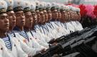 Jubiläumsparade: Zum 65. Geburtstag der herrschenden Arbeiterpartei lässt Nordkoreas Führung Marinesoldaten aufmarschieren. Foto: ap