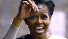 Die erste Dame der USA wühlte sich durch einen Komposthaufen und zog einen lebendigen Wurm heraus: Michelle Obama beim Besuch eines städtischen Bauernhofs in ihrer Heimatstadt Chicago anlässlich ihrer «Let's Move» (Bewegen wir uns) Gesundheitsinitiative. Foto: dapd