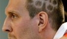 Dallas Mavericks Dirk Nowitzki is seen with some Olympic rings shaved on his head at a news conference at the German House in Beijing, Wednesday, Aug. 6, 2008. Novitzki will carry the German flag during the opening ceremony. (AP Photo/Thomas Kienzle) Foto: ap