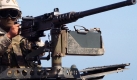 Ein amerikanischer Marineinfantrist hinter einem Maschinengewehr des Kaliber 50. Egal wie viel Technik die westlichen Miitrs auch aufbieten - am Ende werden die asymetrischen Krieg am Boden und mit Soldaten gefhrt. Foto: ddp