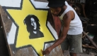 In den Tuff-Gong Studios im jamaikanischen Kingston nahm der Raggae-Musiker Bob Marley einige seiner bekanntesten Stücke auf. Seine Erben versuchen nun, das Geschäft mit Marley-Merchandising unter Kontrolle zu bringen - allein 2009 werden Schätzungen zufolge 600 Millionen Dollar mit unauthorisierten Fanartikeln erlöst. Foto: ap