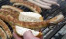 Ein Mitarbeiter einer Fleischerei legt am Samstag in Erfurt auf dem Domplatz zur offiziellen Eröffnung der Thüringer Bratwurstsaison eine Thüringer Rostbratwurst in ein Brötchen. Bereits seit vier Jahren ist die Eröffnung der Bratwurst-Saison zum Volksfest avanciert. Unter der Schirmherrschaft von Ministerpräsidentin Christine Lieberknecht (CDU) geht es auf dem Domplatz einen ganzen Tag lang um nichts anderes als die Wurst. Foto: dapd