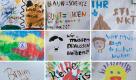 Zwölf Bilder, die während einer Protestkundgebung gegen den Bundesparteitag der NPD vor dem Kulturhaus Stadtgarten an einem Bauzaun hängen  - unter starkem Protest von Einwohnern der Stadt und Initiativen aus ganz Brandenburg ist die rechtsextreme NPD im nordbrandenburgischen Neuruppin zu einem Bundesparteitag zusammengekommen. Die Ankunft der nach Parteiangaben etwa 270 Delegierten wurde am Samstag von Pfiffen und «Nazis raus»-Rufen begleitet. Foto: dapd