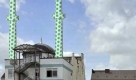 Die mit grünen und weißen Sechsecken bemalten Minarette der Centrum-Moschee in Hamburg St. Georg in einer undatierten Fotomontage. Der Künstler Boran Burchhardt will mit seinem Kunstprojekt 'Darf ich mal Ihr Minarett anmalen?' die Minarette mit einem Muster aus grünen und weißen Sechsecken anmalen. Anfang September sollen die neu gestalteten Türme wieder aufgestellt werden. Foto: Marcel Stammen/Montage: Boran Burchhardt dpa/lno (ACHTUNG: Verwendung nur mit o.a. Urheberhinweis) +++(c) dpa - Bildfunk+++ Foto: dpa