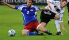 Germany's forward Lukas Podolski, right, and Liechtenstein's defender Marco Ritzberger challenge for the ball during the World Cup group 4 qualifying soccer match between Germany and Liechtenstein in Leipzig, Germany, on Saturday, March 28, 2009. Germany won by 4-0. (AP Photo/Fabian Bimmer) Foto: ap