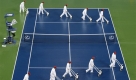 Die Stunde der Trockenleger: Das Match zwischen Rafael Nadal und Fernando Gonzales bei den US Open im Tennis musste wegen des starken Regens unterbrochen werden. Foto: ap