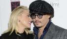 Actors Amber Heard and Johnny Depp attend the premiere of 'The Rum Diary' at the Museum of Modern Art on Tuesday, Oct. 25, 2011 in New York. (AP Photo/Evan Agostini) Foto: dapd