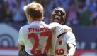 Historischer Aufstiegs-Jubel in Augsburg: Die Augsburger Michael Thurk (l) und Gibril Sankoh bejubeln den 2:1-Heimsieg gegen den FSV Frankfurt. Mit heißem Herzen, unwiderstehlichem Vollgas-Fußball und dem erlösenden Siegtor von Joker Stephan Hain in der 85. Spielminute ist der FC Augsburg erstmals in seiner Vereinsgeschichte in die Bundesliga gestürmt. Nach 90 dramatischen Spielminuten und einem hochverdienten Sieg brachen um 15.19 Uhr nach dem Schlusspfiff in der Augsburger Arena alle Dämme - der FCA hat am vorletzten Zweitliga-Spieltag sein Ziel erreicht. Foto: dpa