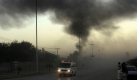 An ambulance rushes to the spot of a suicide bombing in Peshawar, Pakistan on Friday, Nov. 13, 2009. A suicide car bomb devastated Pakistan's main spy agency building in the northwest Friday, killing at least 7 people and striking at the heart of the institution overseeing much of the country's anti-terror campaign.(AP Photo/Mohammad Sajjad) Foto: ap