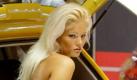Die 26-jährige Miss Tuning, Katharina Kuhlmann, posiert am Freitag (28.11.2003) auf der Motor Show 2003 in Essen auf einem Tuning-Stand. Vom 28. November bis zum 7. Dezember zeigen 570 Aussteller aus 19 Nationen in 19 Messehallen alles rund ums Auto und Motorrad. Neben vielen historischen und neuen Autos werden den über 400 000 erwarteten Besucher viele unverkäufliche Einzelstücke und zahlreiche Neuigkeiten aus dem Bereich Tuning gezeigt. Foto: Gero Breloer dpa/lnw Foto: dpa