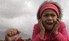 A child reacts as the Athlone cooling towers are demolished on the outskirts of the city of Cape Town, South Africa, Sunday, Aug. 22, 2010. The Athlone coal-fired power station has been decommissioned and declared unsafe. (AP Photo/Schalk van Zuydam) Foto: ap