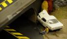 Eine Szene am Rande der Carrera-Bahn im grossen Masstab, der Slotcar-Bahn, der Slot Racing Interessens-Gemeinschaft Teutoburger Wald (SRIG Teuto), zeigt am Freitag (08.01.10) in Aschendorf bei Osnabrueck einen Verkehrsunfall an einem Bruckenpfeiler. Synchron bewegen sich die Koepfe von Willy Knigge und Andreas Lippold, Mitglieder SRIG Teuto, von links nach rechts und wieder zurueck. Die beiden grauhaarigen Herren liefern sich ein Kopf-an-Kopf-Rennen auf der Rennbahn. Waehrend ihre Augen den Rennverlauf verfolgen, bestimmen ihre Daumen die Geschwindigkeit ihrer Slotcars, die auf der 32 Meter langen und sechsspurigen Bahn in ihrem Clubhaus in Aschendorf im Landkreis Osnabrueck ihre Kreise ziehen. Zahlreiche Arbeitsstunden haben die beiden in die groesste Slotcar-Bahn Niedersachsens investiert und sich damit einen Kindheitstraum erfuellt, wie sie sagen. (zu ddp-Text) Foto: David Hecker/ ddpd Foto: ddp