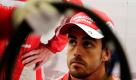 Der spanische Formel-1-Fahrer Fernando Alonso vom Team Ferrari wartet auf den Start der ersten Übungseinheit vor dem belgischen Grand Prix an der Rennstrecke von Spa-Francorchamps. Die Rennstrecke liegt mitten in den Ardennen und gilt damit als eine der schönsten Strecken der Welt. Foto: ap