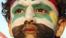 A Syrian boy, with his face painted with the Syrian flag and  Arabic writing that reads:'Syria of Assad,', as he attends a rally in support of Syrian President Bashar Assad at the Umayyad Square in downtown Damascus, Syria, Sunday, July 17, 2011. The rally is held to mark the 11th anniversary of Assad's swearing-in ceremony and to voice allegiance and loyalty to their leader whose country has been plagued by four months of protests.  (AP Photo/Bassem Tellawi) Foto: dapd