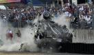 Schwerer Unfall:Kurz nach dem Start der legendären 24 Stunden von Le Mans fuhr der Audi-Pilot Allan McNish mit voller Wucht in einen Reifenstapel. Nach dem Crash stieg der Schotte aus eigener Kraft und unverletzt aus dem völlig demolierten Wagen. Auch Zuschauer und Fotografen wurden nicht verletzt. Foto: dpa