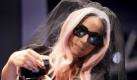 Lady Gaga, right, describes the new Polaroid GL30 instant digital camera with Chairman of the Board Bobby Sager, during the Consumer Electronics Show, Thursday, Jan. 6, 2011 in Las Vegas. Lady Gaga is Polaroid's creative director. (AP Photo/Julie Jacobson) Foto: dapd