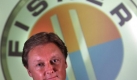 Mann - Vision - Marke. Henrik Fisker vor dem Logo seiner gleichnamigen Elektro-Sportwagenschmiede. Foto: news.de
