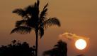 Der Sonnenaufgang über der U.S. Marine Corps Base in Kaneohe Bay auf Hawaii, wo die Obamas gerade ihren Urlaub verbringen. Foto: ap